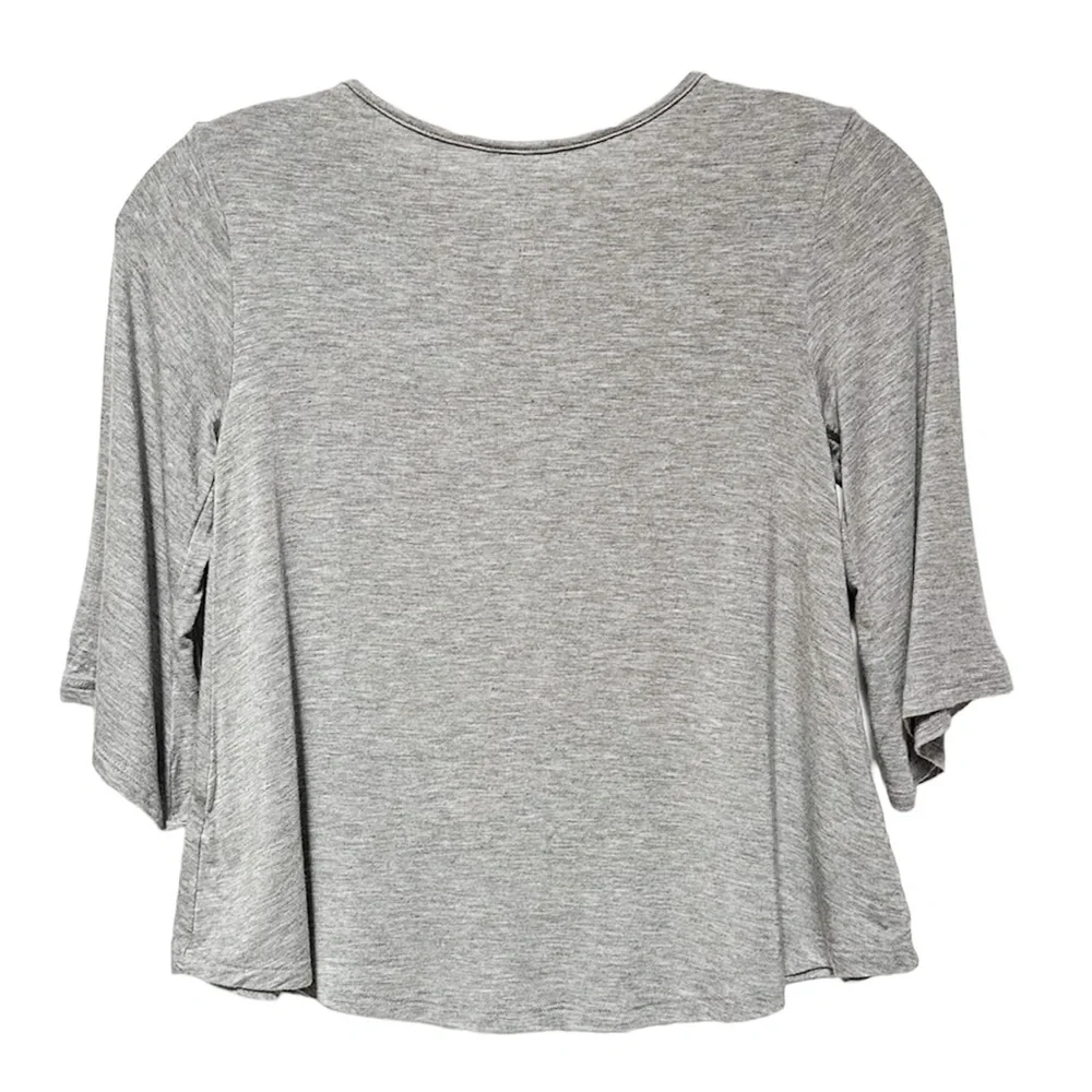Justice Tassel Tie Neck Swing Jersey Top